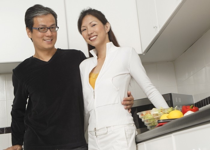 asian woman and man in kitchen