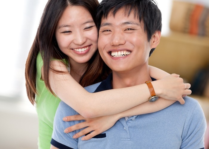 asian guy and girl at home