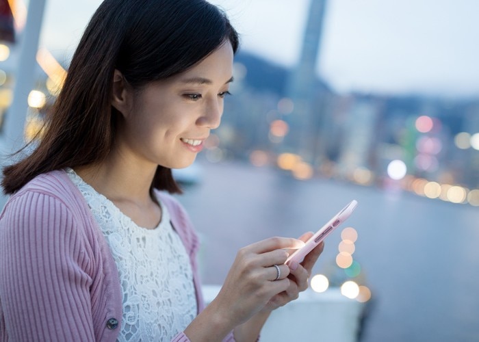 woman reading message on phone