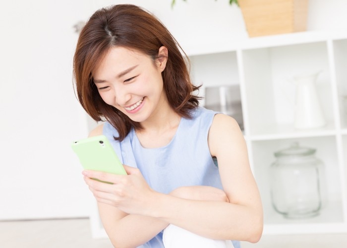 young asian woman with smartphone