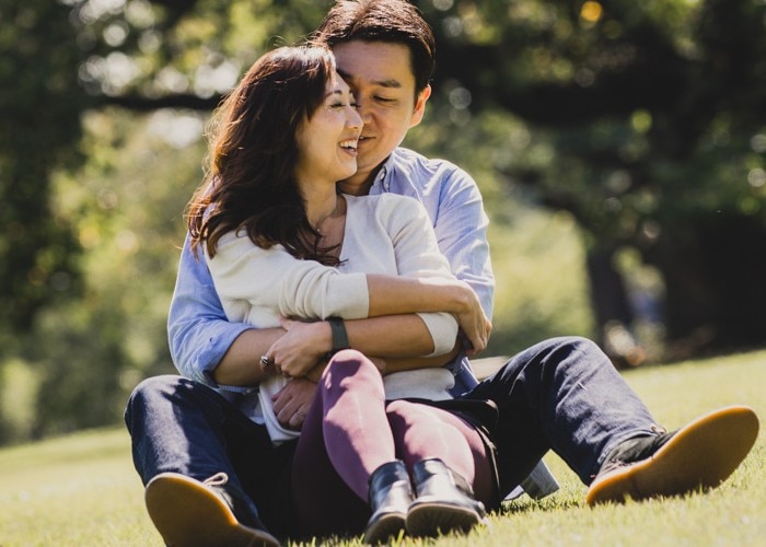 man hugs woman